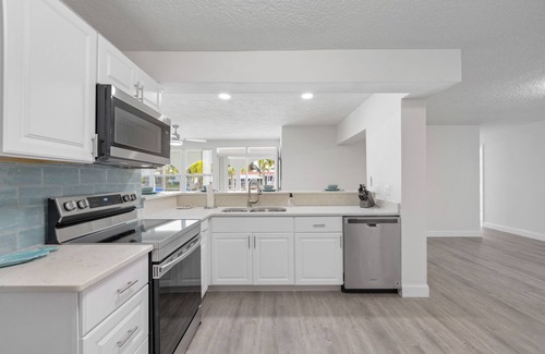Cocoa Beach House | Water's Edge Retreat with Pool, Hot Tub & Game Room. 3 minutes to the Beach!