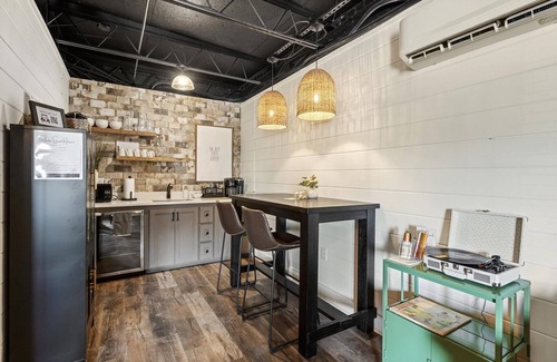 Biloxi Apartment | Water Street Retreat is a cozy dog-friendly studio in downtown Biloxi, steps from beaches, casinos & dining. Features a king bed, sofa bed, kitchenette, modern bath, Wi-Fi & easy parking—perfect for exploring the coast.