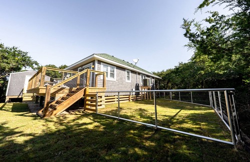 Waves Cottage | Waterfront 2-Bedroom, 1-Bathroom Cottage with a Hot tub and Waterfront Deck