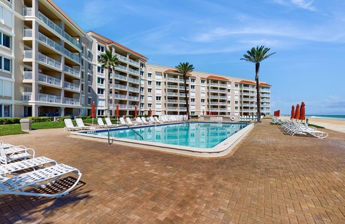 New Smyrna Beach Condo | Waterfront condo with pool,beach access, and resort amenities