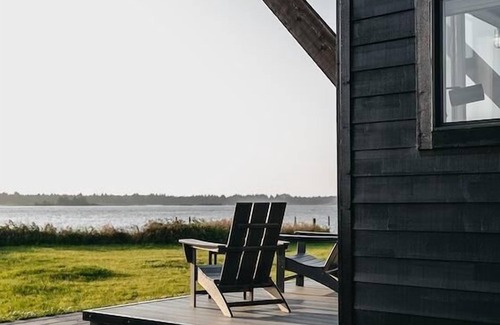 Coos Bay Cabin | Waterfront Drift Cabin - Our Drift cabin is light and airy with a spacious living room. Private bedroom with King bed, living room has large sofa sleeper. Sleeps 4.