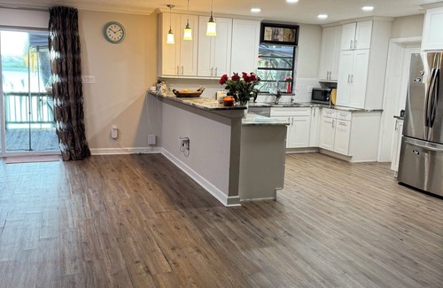 Eustis House | Waterfront Getaway Sauna Hot Tub Jet Skis Sunset Views