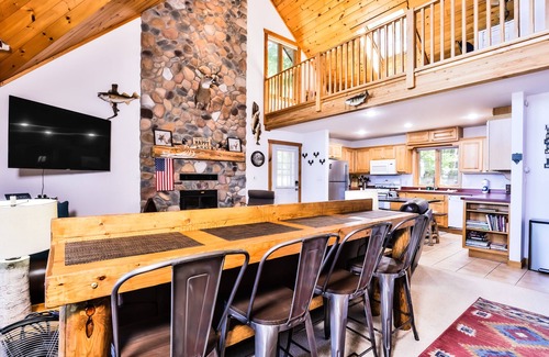 Eagle River Cottage | Waterfront getaway with wood fireplace, dock, & lakeside deck