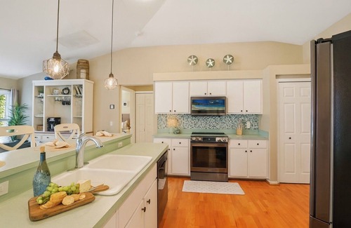 Pelican House | Waterfront Gulf-Access Escape | Heated Pool Dock Game Room + Tiki Bar