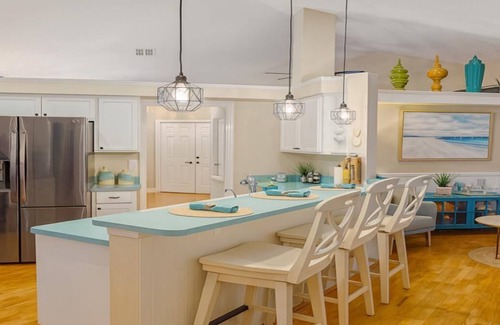 Pelican House | Waterfront Gulf-Access Escape | Heated Pool Dock Game Room + Tiki Bar