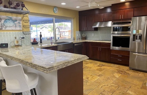 Garden Isles House | Waterfront, heated Pool enclosed, our home is completely renovated, very private