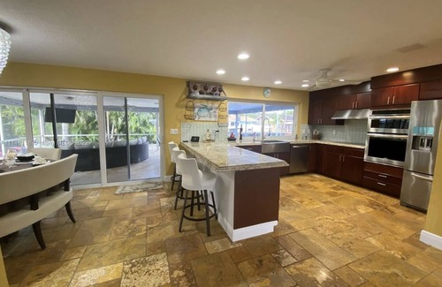 Garden Isles House | Waterfront, heated Pool enclosed, our home is completely renovated, very private