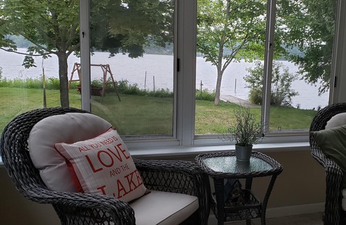 Lake Leelanau House | Waterfront home Lake Leelanau. Enclosed porch, WIFI. Canoe, row boat Dog ok.
