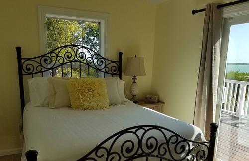 Bay Point House | Waterfront home with open water view, dock, hot tub, private beach, dog friendly