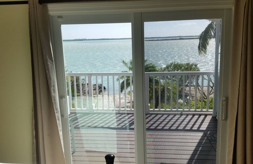 Bay Point House | Waterfront home with open water view, dock, hot tub, private beach, dog friendly