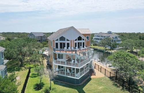 Sunset Village House | Waterfront home with ocean views, private pool, hot tub, & Tesla/EV charger