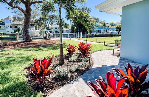 Palm Harbor House | Waterfront Island Oasis FULLY REMODELED! W/BOAT DOCK!