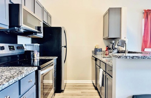 Wayne Apartment | Waterfront King Suite w Balcony