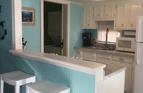 Surfside Beach Cottage | Waterfront, Large deck, Pet friendly, Golf cart, Screened in porch.