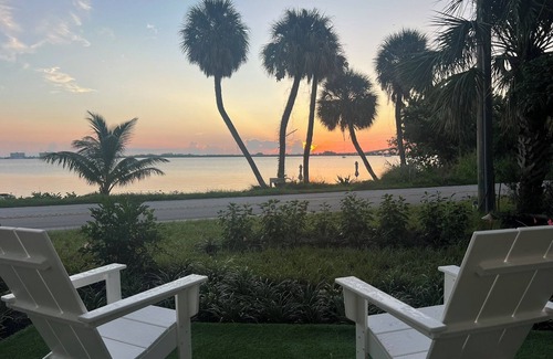 Jensen Beach House | Waterfront luxury bungalow with private beach, paddleboards, kayaks and bikes!