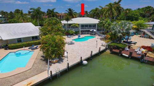 Key Colony Beach House | Waterfront Luxury Home with Pool and Boat Dock home