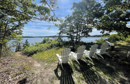 Waquoit Village Cottage | Waterfront on Waquoit Bay. 2.5 acre private. Sunsets, swim, kayaks, fish.