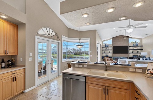 Punta Gorda House | Waterfront Punta Gorda Isles 3 Bedroom pool hot tub, dock, bikes office