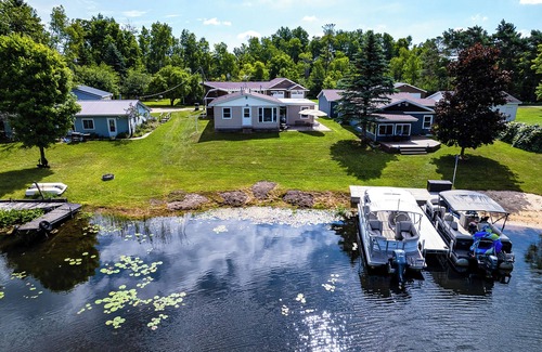 Reed City House | Waterfront Retreat w/Dock & Yard in Reed City!