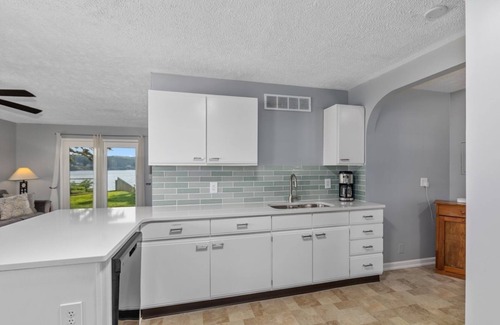 Newaygo Condo | Waterfront Suite: Dock, Kayaks, Firepit, BBQ