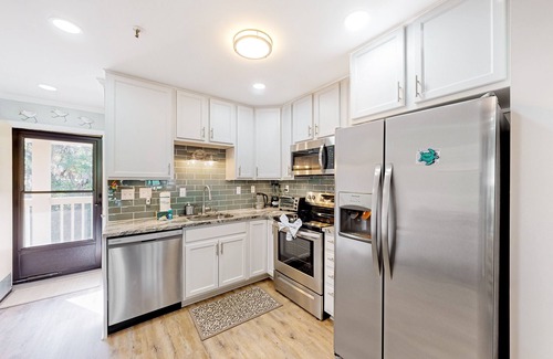 Palmetto Dunes Villa | Waterfront villa with resort amenities, beach access, open layout, AC, & W/D
