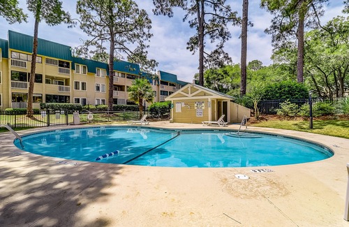 Palmetto Dunes Villa | Waterfront villa with resort amenities, beach access, open layout, AC, & W/D