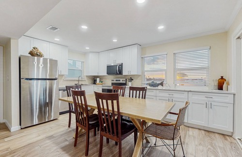 Holiday Isle Villa | Waterfront villa with multi level home, shared pool & easy beach access