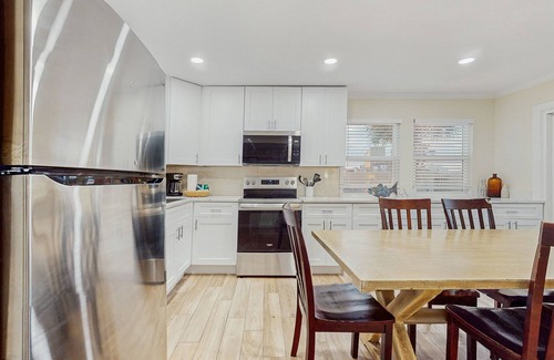 Holiday Isle Villa | Waterfront villa with multi level home, shared pool & easy beach access