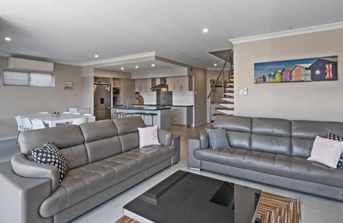 Exmouth House | Wave - Modern Villa on the Exmouth Marina with boat mooring.