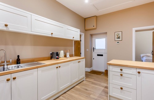 Driffield Cottage | We love this historic lodge with large garden and wood fired hot tub.