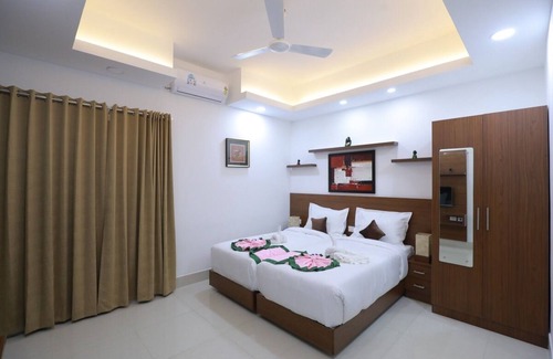 Thampanoor House | Welcome to our exquisite hotel suits nestled in the heart of Trivandrum