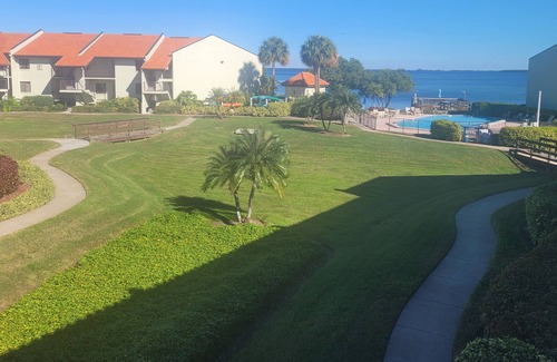 Tierra Verde Condo | Welcome to the island lifestyle with garden and pool views on Tierra Verde!