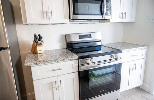 Belleair Shore House | Welcome to your private coastal getaway! This fully renovated 3-bedroom, 2-bath single family home is perfectly located on the Intracoastal Waterway—just a 2-minute walk to the sugar-white sands of Indian