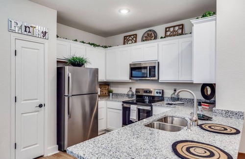San Antonio House | Welcome to your perfect San Antonio home! This spacious 3-bedroom, 2.5-bath house features a large, fully equipped kitchen and plenty of room for family and friends. Enjoy modern comforts, a private backyard, and easy access to downtown attractions.