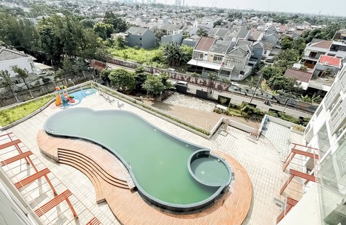 Serpong Apartment | White Tone Studio At Amazana Serpong Apartment