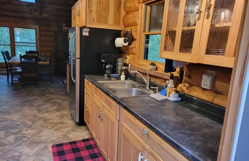 Isabella Cabin | Wilderness Log Home on the River Ely Lakes Fish Hike Ski Snowmobiling ATV Pets