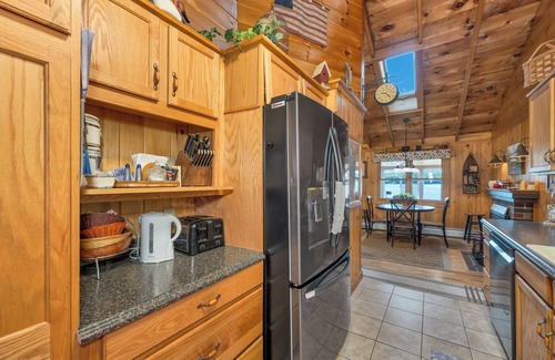 Moultonborough House | Winnipesaukee Lake Front Cottage with Sandy Beach and 25ft Dock Sleeps 8