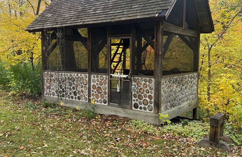 Plymouth House | Wooded lot with wildlife, indoor treehouse and screened porch: a family paradise