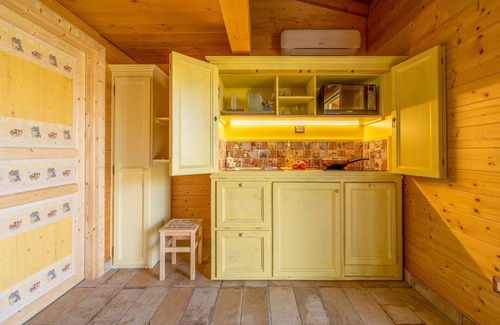 San Brizio Apartment | Wooden house with porch and garden