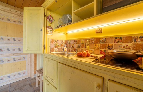 San Brizio Apartment | Wooden house with porch and garden