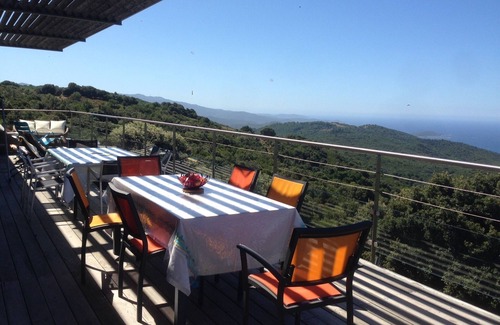 Pietrosella House | Wooden lodge on piles nestled in the scrubland,view over the Bay of Ajaccio