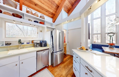 Durham House | Woodland acreage with 60' deck on gurgling brook, pizza oven, rec area & library