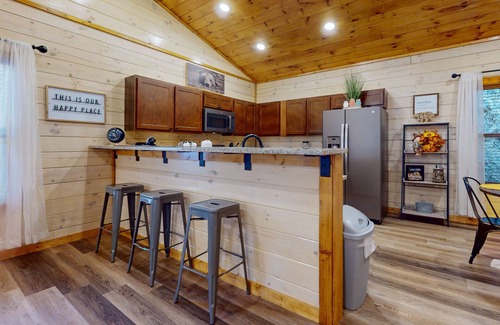 Sevierville Cabin | Woodland Retreat w/Hot Tub, Scenic Porches & Free Attraction Tickets