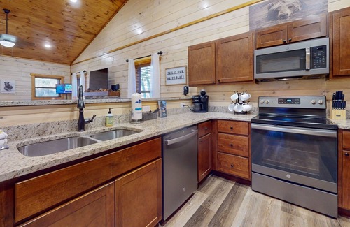 Sevierville Cabin | Woodland Retreat w/Hot Tub, Scenic Porches & Free Attraction Tickets