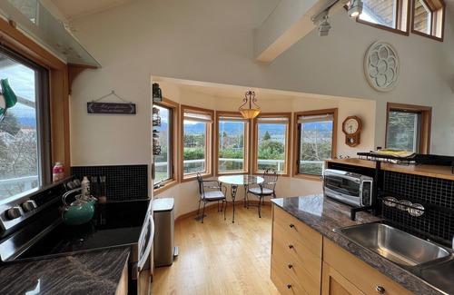 Fanny Bay House | Wraparound Deck w/Ocean and Mountain Sunset Vista