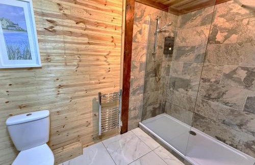 Llanybri Ski Chalet | Wren 21-Hot Tub-Woodland Lodges-Tenby-Camarthenshire