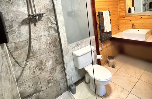 Llanybri House | Wren 23-Hot Tub-Woodland Lodges-Tenby-Pembroke