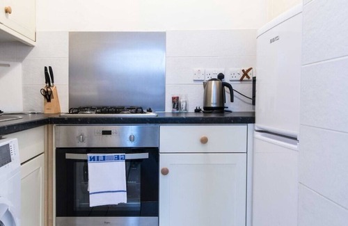 Woodthorpe Apartment | You’ll love putting your feet up in the lounge area, complete with Smart TV and snug sofa space