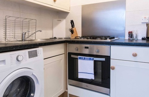 Woodthorpe Apartment | You’ll love putting your feet up in the lounge area, complete with Smart TV and snug sofa space