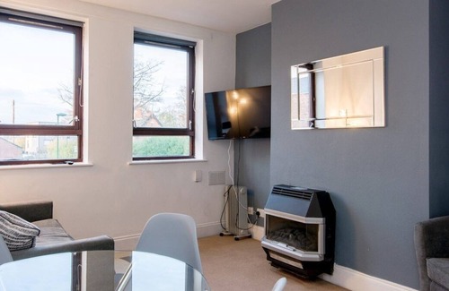 Woodthorpe Apartment | You’ll love putting your feet up in the lounge area, complete with Smart TV and snug sofa space